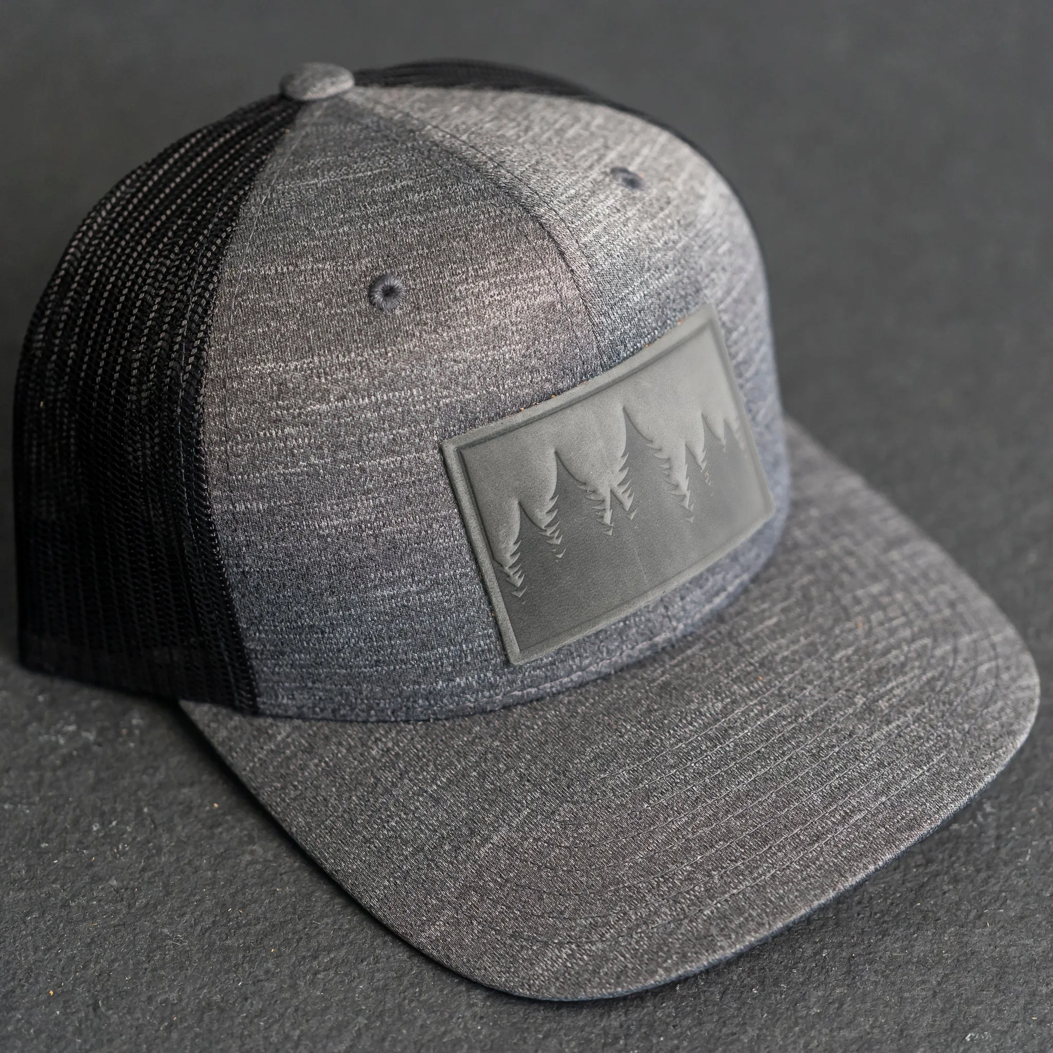 Leather Patch Performance Style Trucker Hat - Pine Tree Ridgeline Stamp