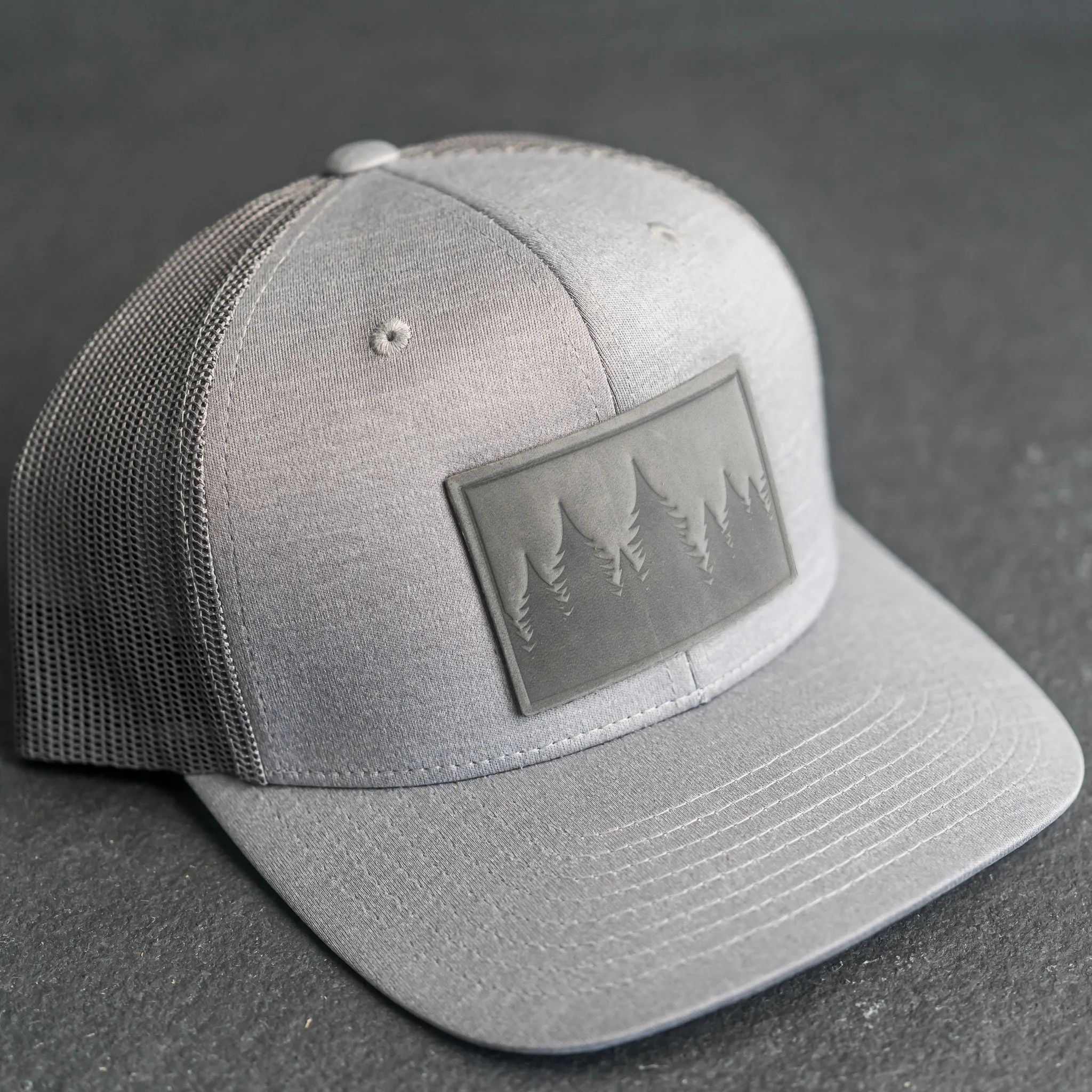 Leather Patch Performance Style Trucker Hat - Pine Tree Ridgeline Stamp