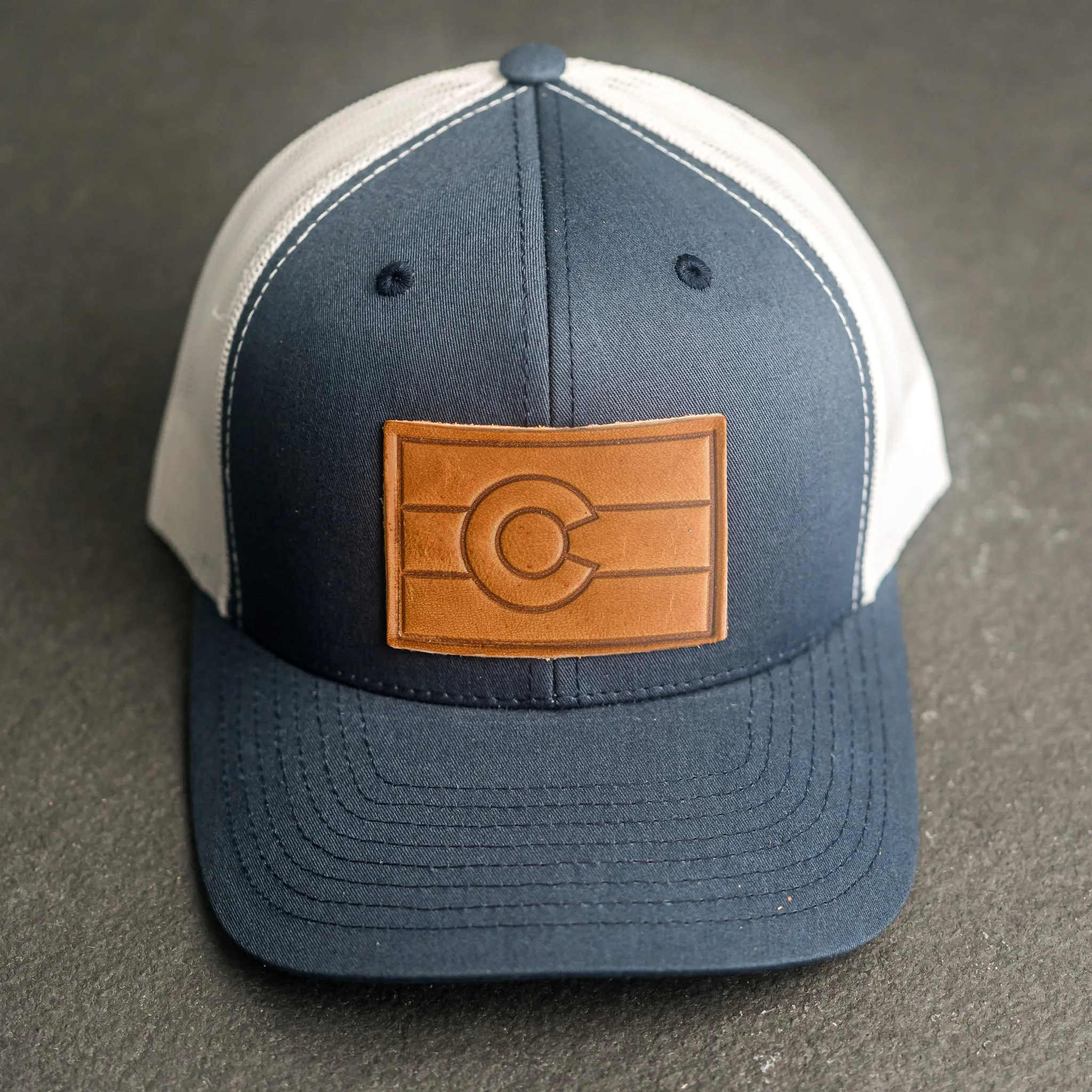 Leather Patch Trucker Style Hat - Colorado Flag Stamp