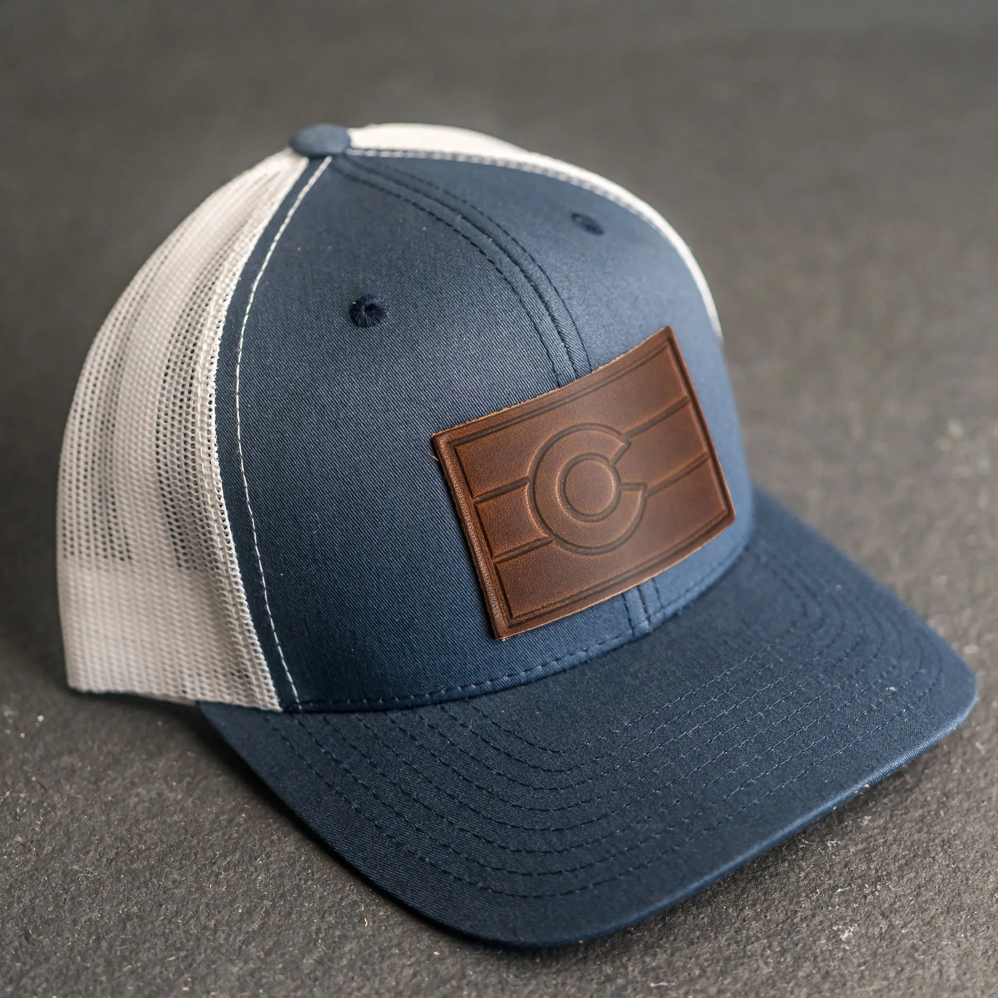 Leather Patch Trucker Style Hat - Colorado Flag Stamp