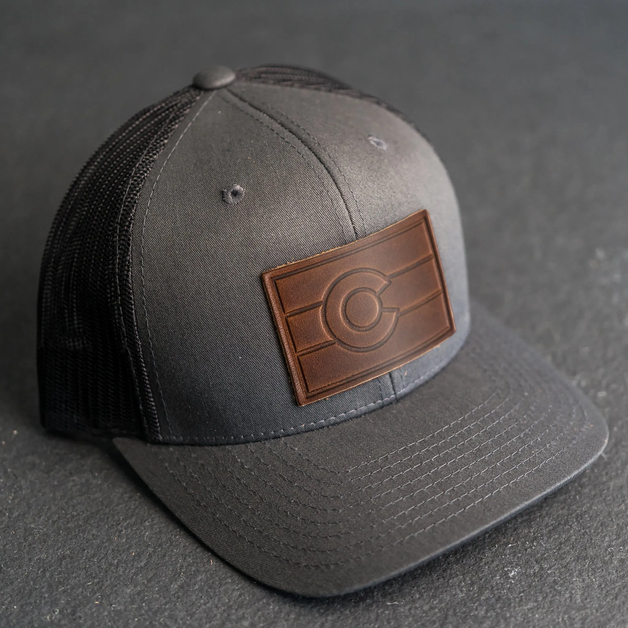 Leather Patch Trucker Style Hat - Colorado Flag Stamp